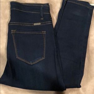 Size 7 dark blue skinny jeans.